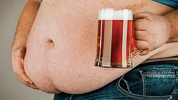 Fat belly due to junk food or beer drink
